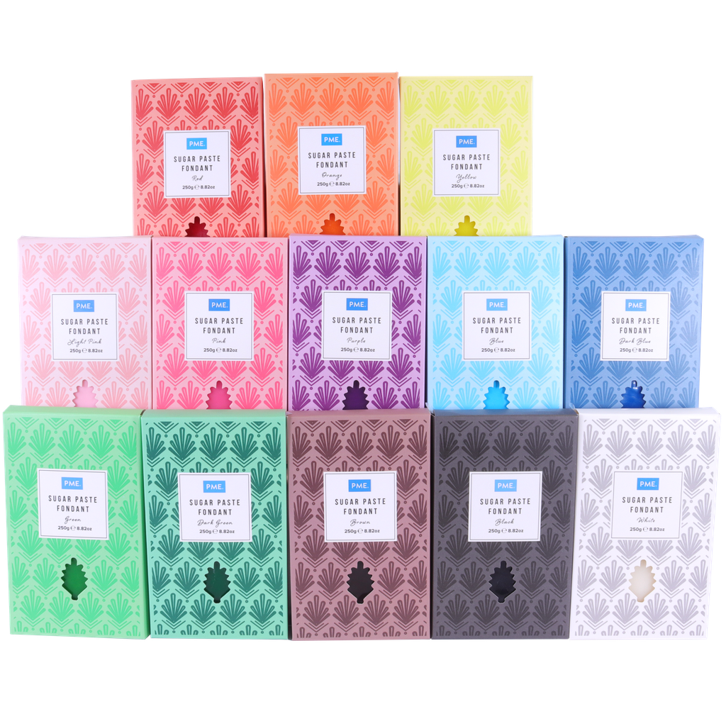 Collection of PMe coloured sugar paste on a white background