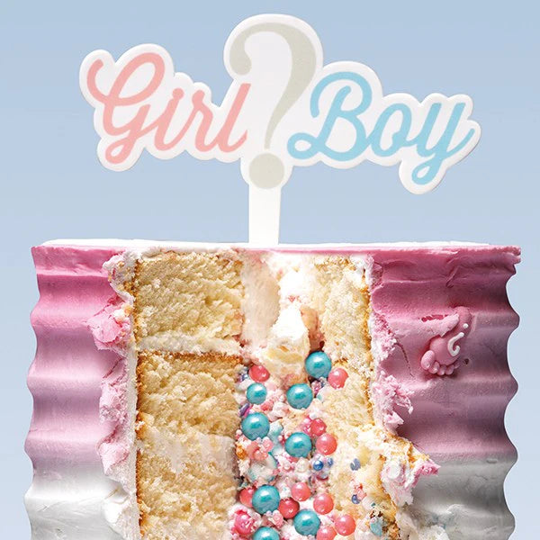 Half-eaten cake with pink and white frosting, blue and pink sprinkles, and a 'Girl? Boy?' topper against a light blue background.