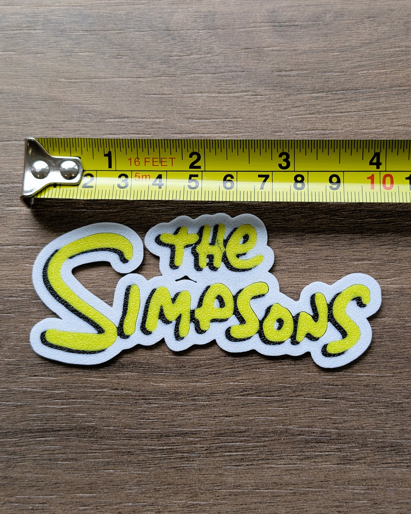 The Simpsons Sign Cake Charm