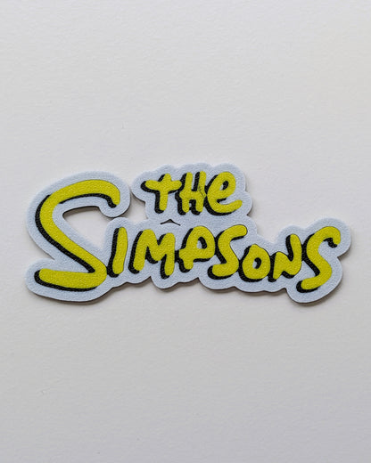 The Simpsons Sign Cake Charm