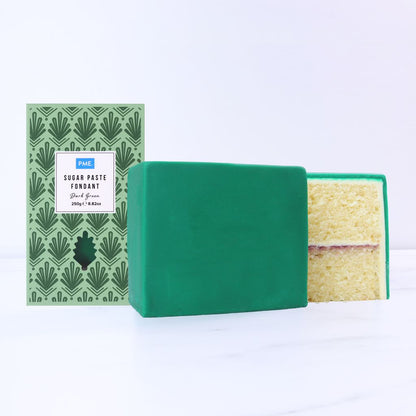 Green covered cake  on a white background