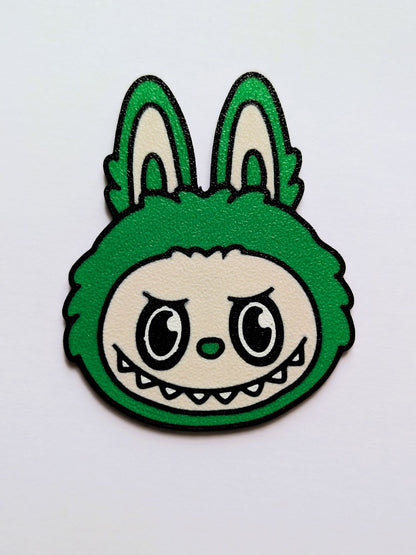 Green Labubu/Lafufu character with a grumpy expression on a white background