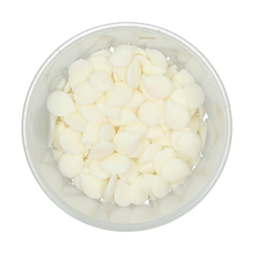 Clear container filled with bright white Wilton candy melts on a white background