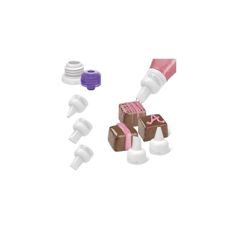 Set of wilton candy melt nozzles on a white background