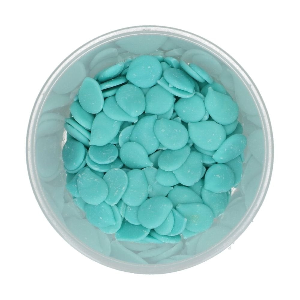 light blue wilton candy melts in a clear container on a white background