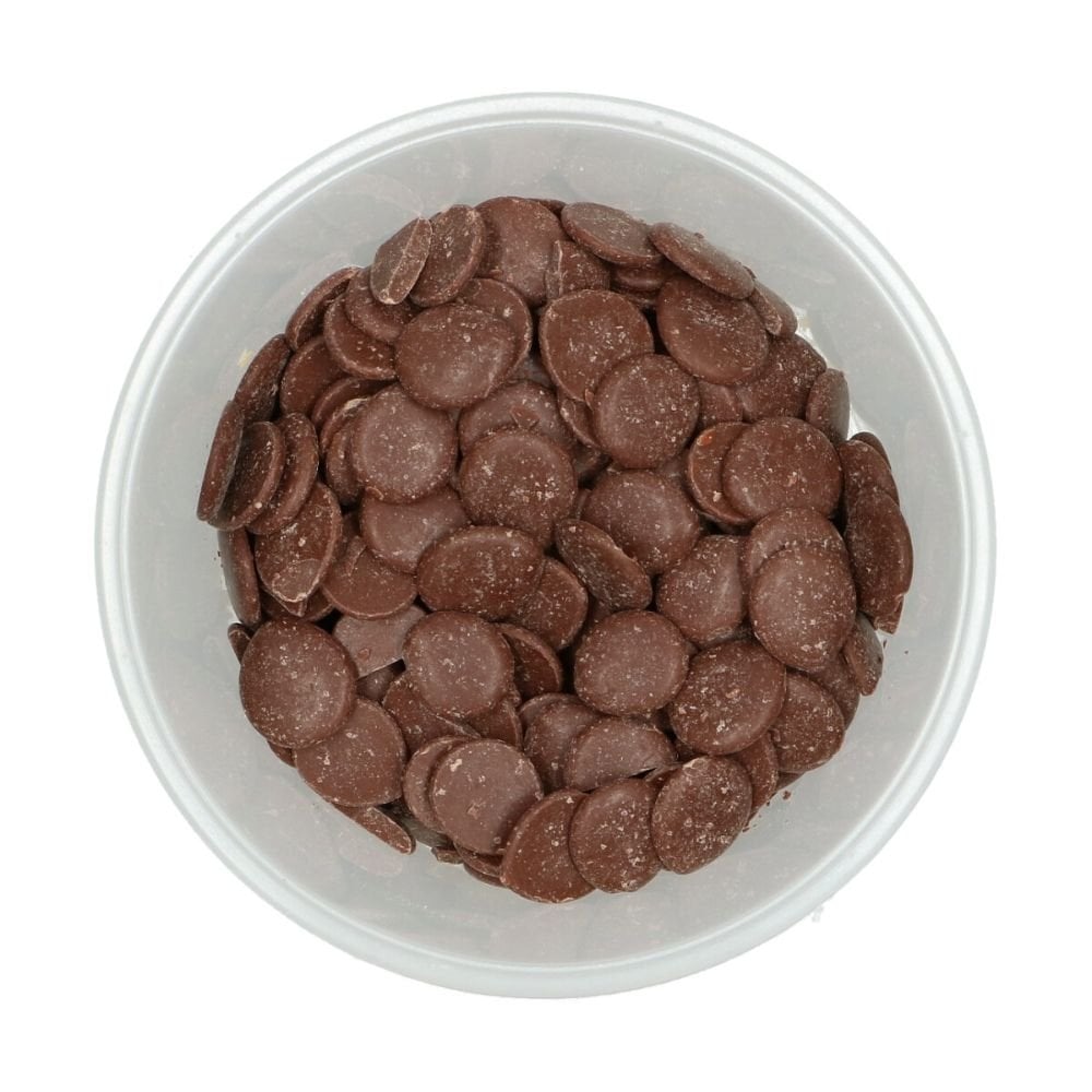 White bowl filled with Wilton light cocoa candy melts on a white background