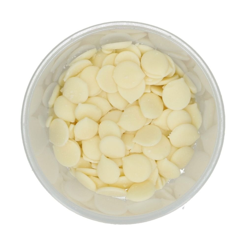 Clear container filled with white Wilton candy melts on a white background